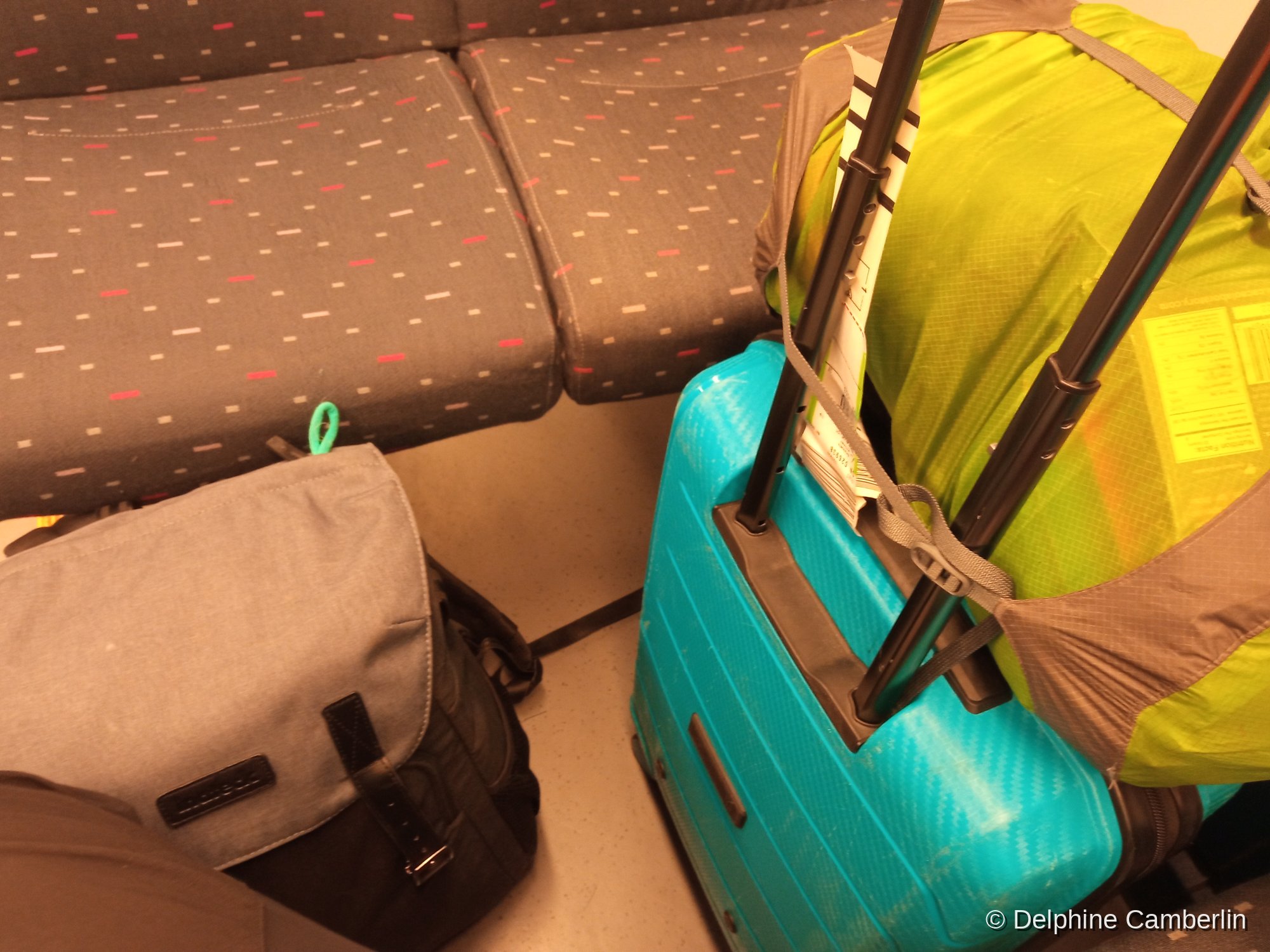 Luggage on Belgian train — sustainable European rail travel