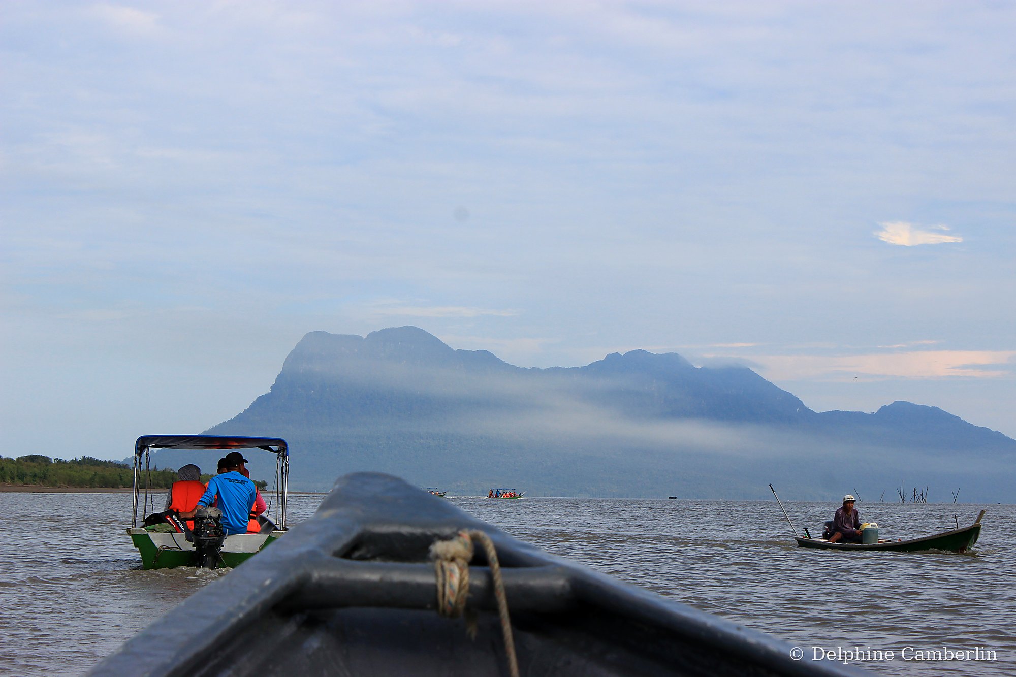 Flores Komodo islands — boat in misty mountains