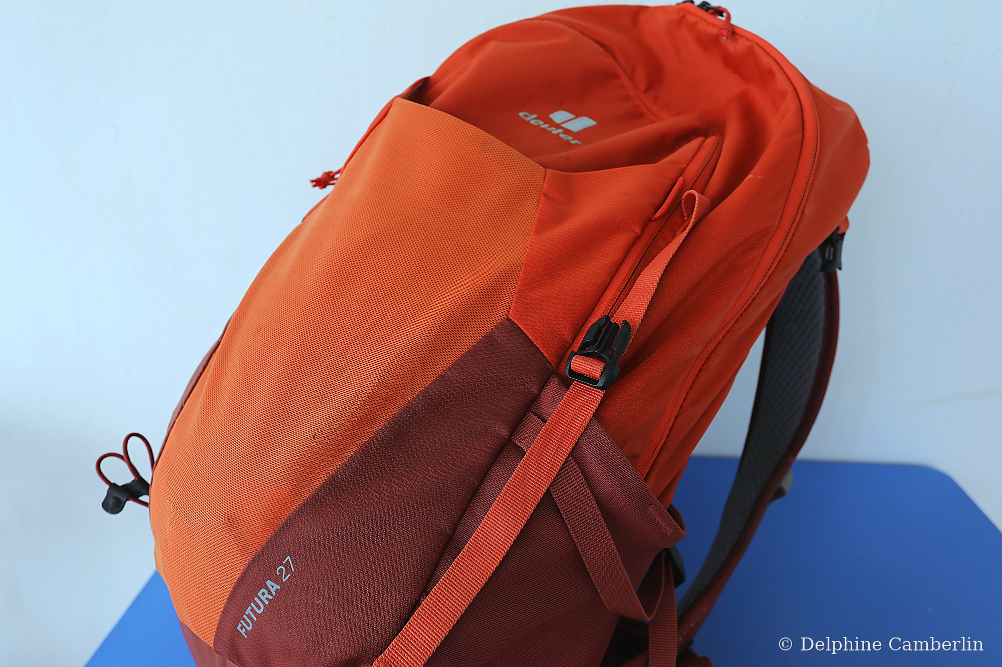 Outdoor backpack closeup on blue surface