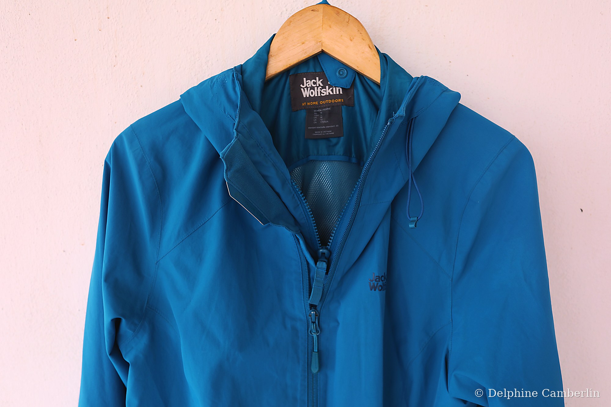 Outdoor brand jacket hanging on a wooden hanger