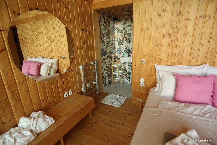 DunaTwinHouse Natural Lodge, Danube Bend, Hungary – Wooden cabin bedroom and leaf-wallpaper bathroom