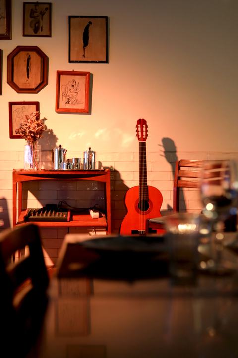 Fama d’Alfama Restaurant, Lisbon, Portugal – Fado guitar corner warm light